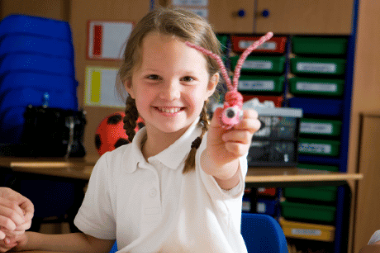 Child showing a craft she has made