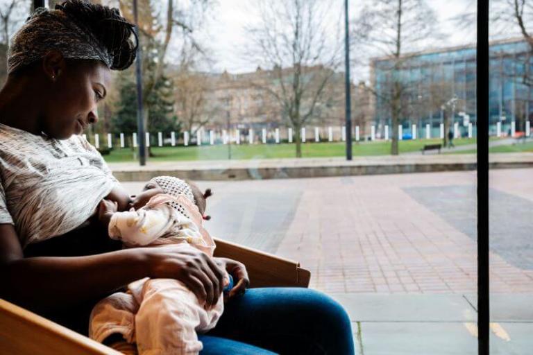 Young mother breastfeeding her child