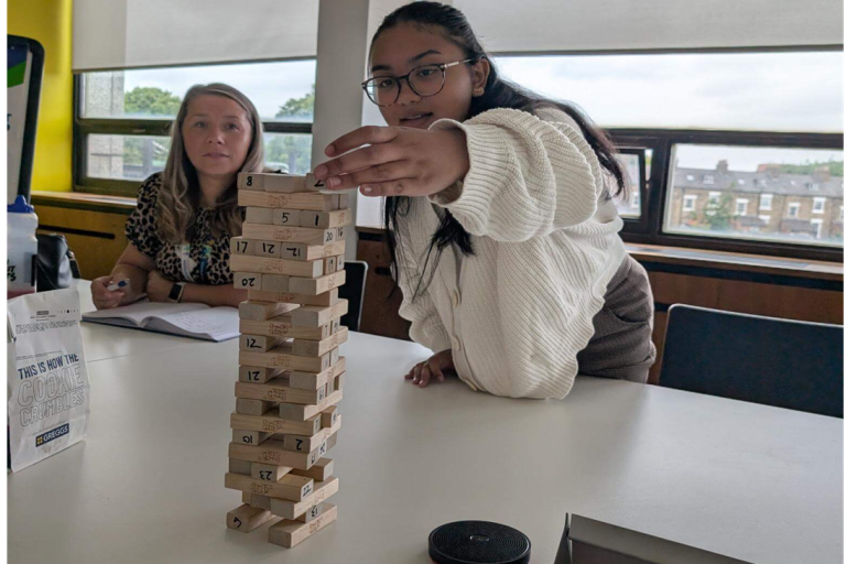 Young person playing jenga 