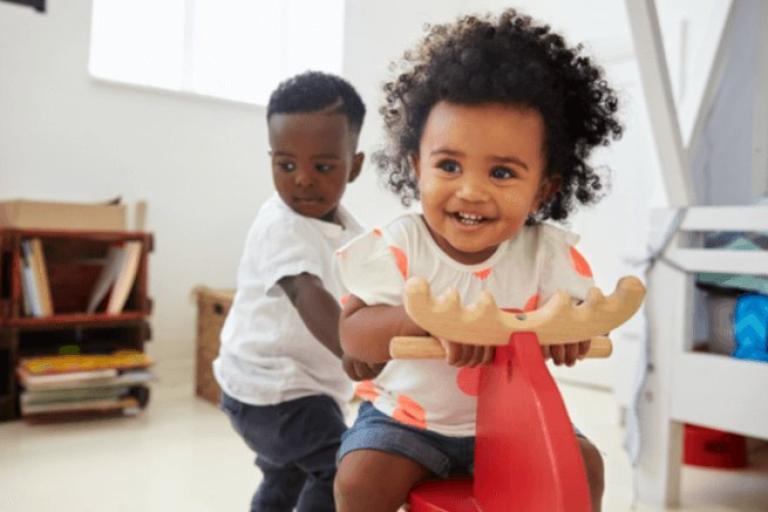 Children on Rocking horse toy