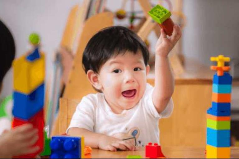 29102025 child playing with building blocks