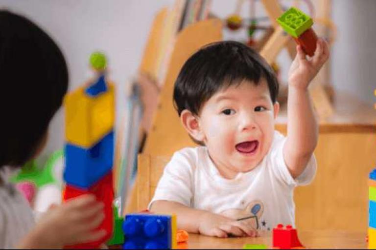 Child playing with building blocks
