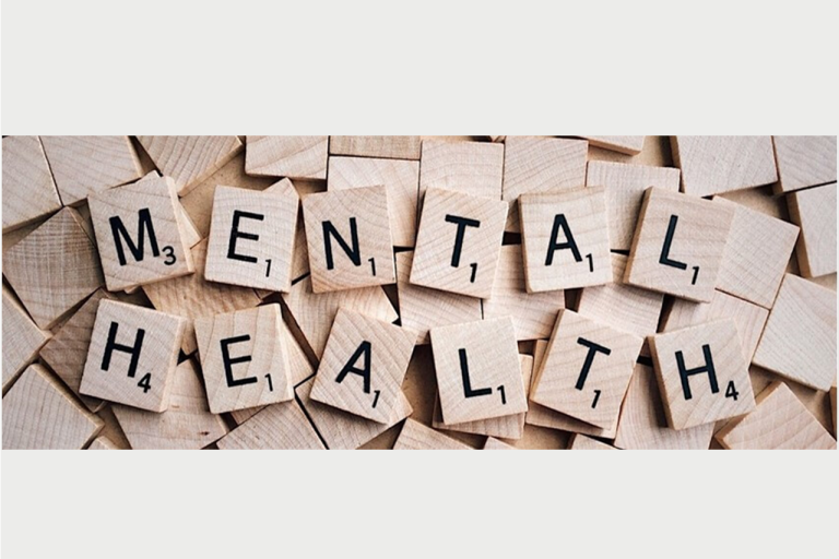 Wooden scrabble letters spelling out the words mental health 