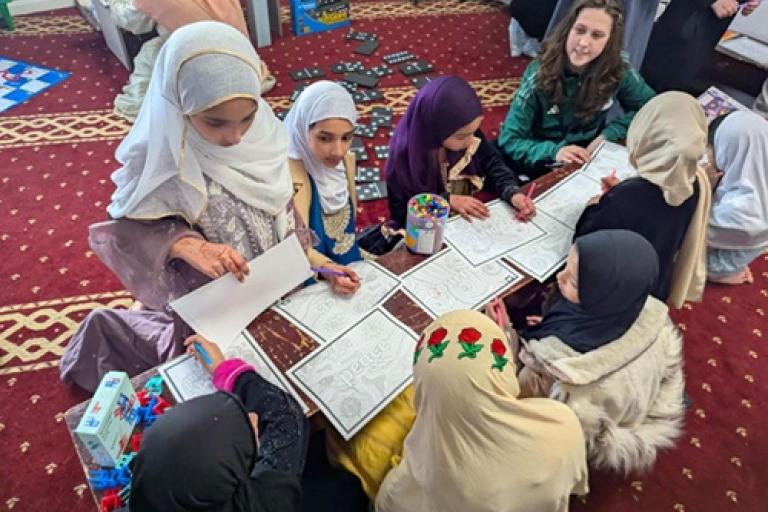 Children enjoying crafts at the Eid Celebration party