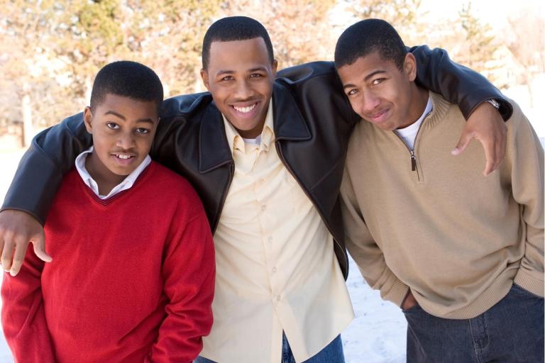 Young adult male with two teenage males