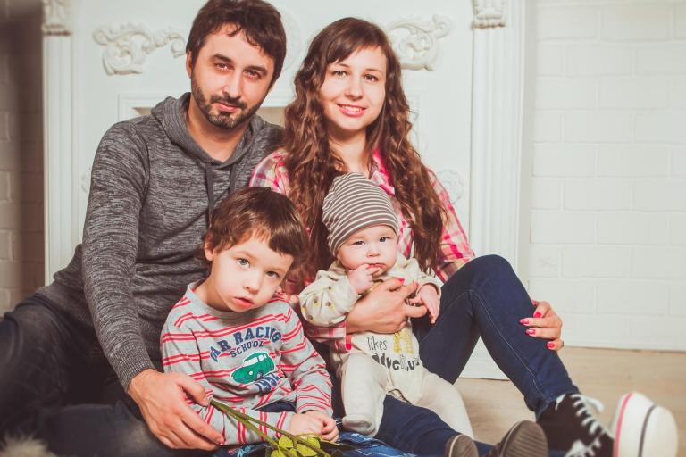 Couple with toddler and baby